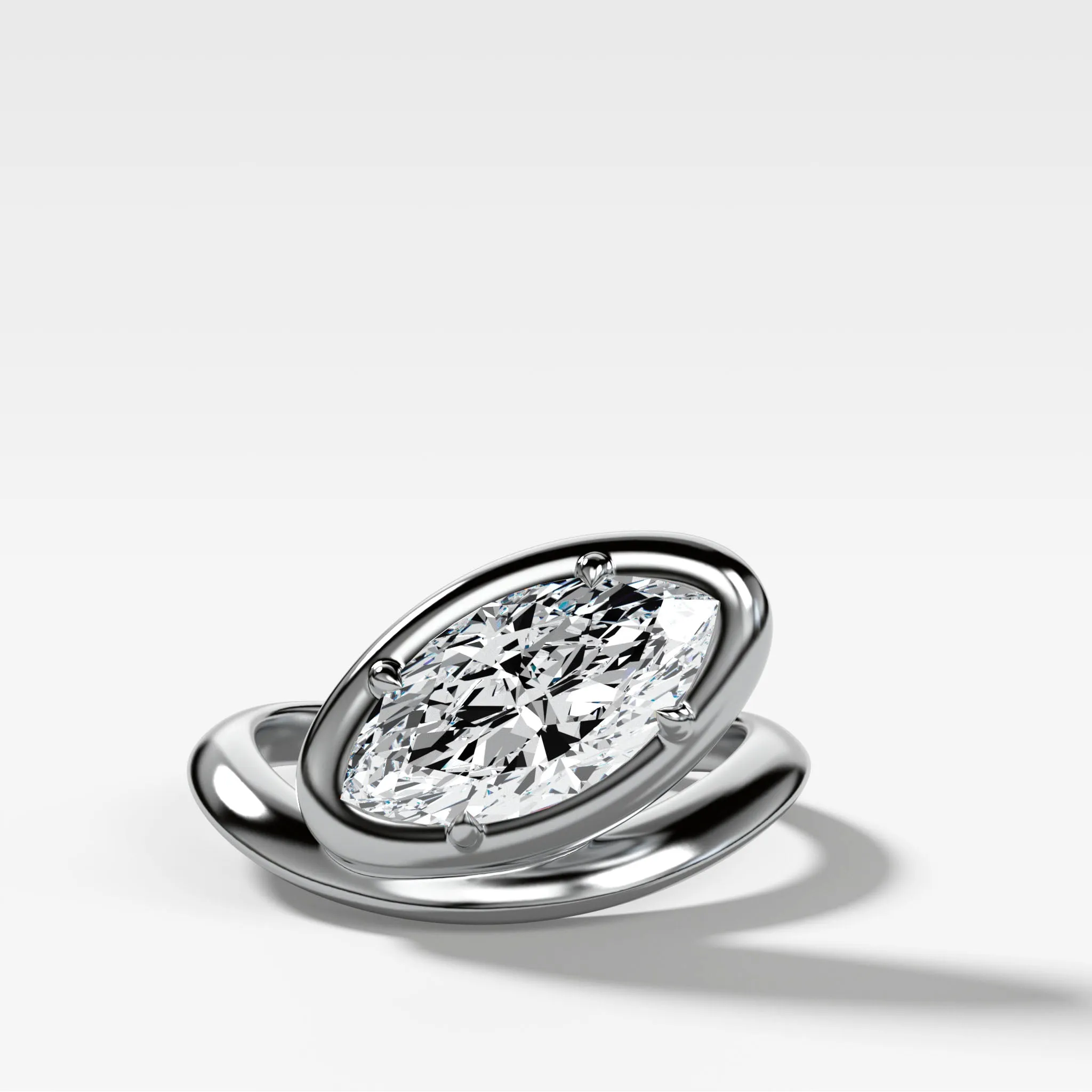 Contoured Club Engagement Ring with a Marquise Cut Diamond