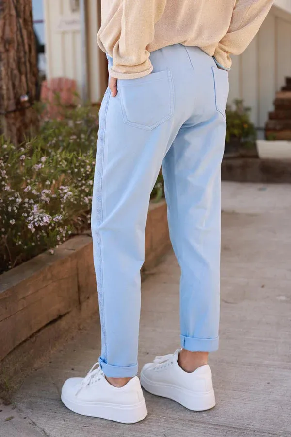 Light blue cotton jogging bottoms with embroidered cheveron outseams