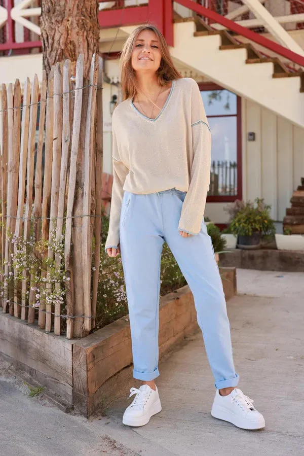 Light blue cotton jogging bottoms with embroidered cheveron outseams