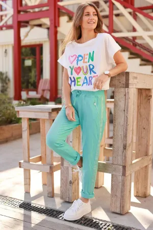 Turquoise cotton jogging bottoms with embroidered cheveron outseams